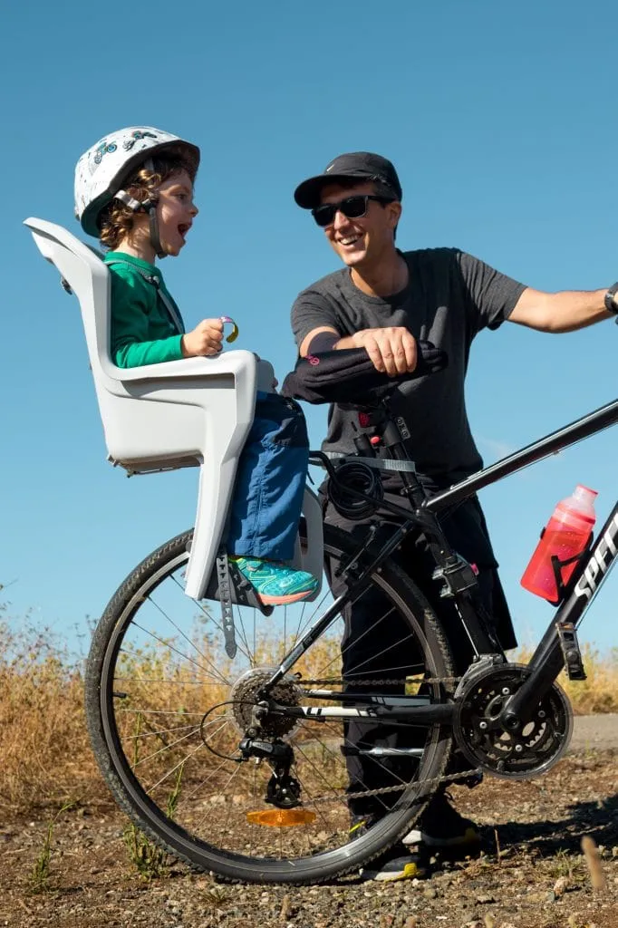 Back mounted child bicycle seat, our son hates it 2 bike child seat