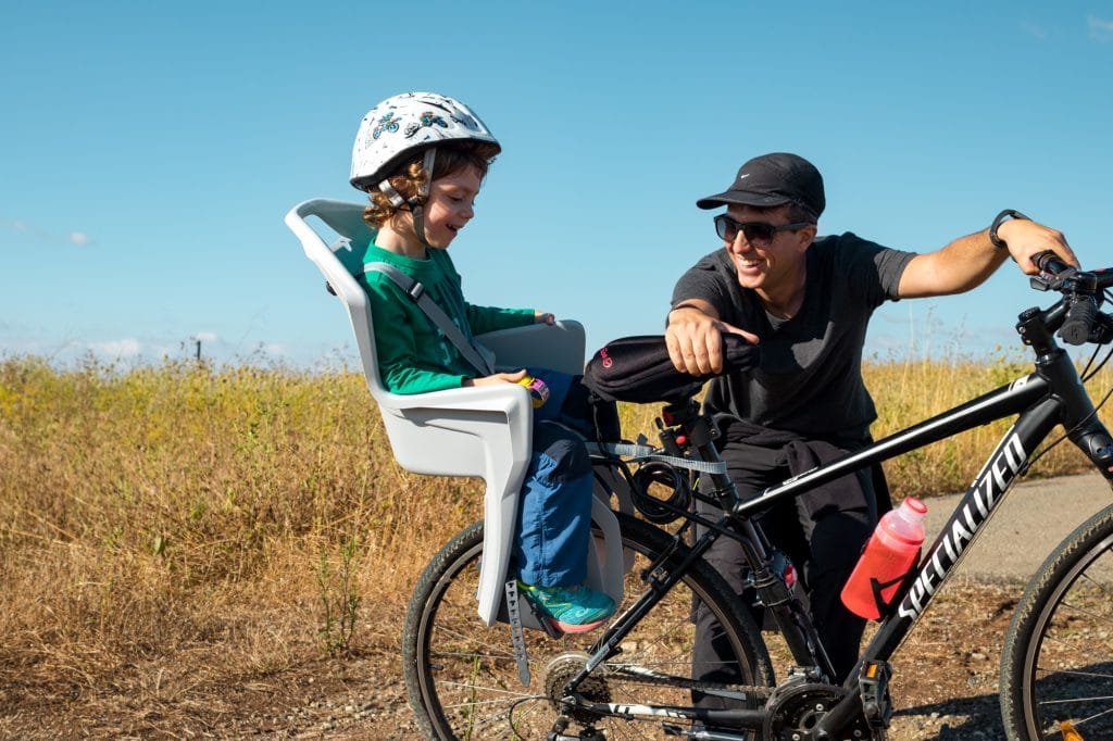 Back mounted child bicycle seat, our son hates it 3 bike child seat