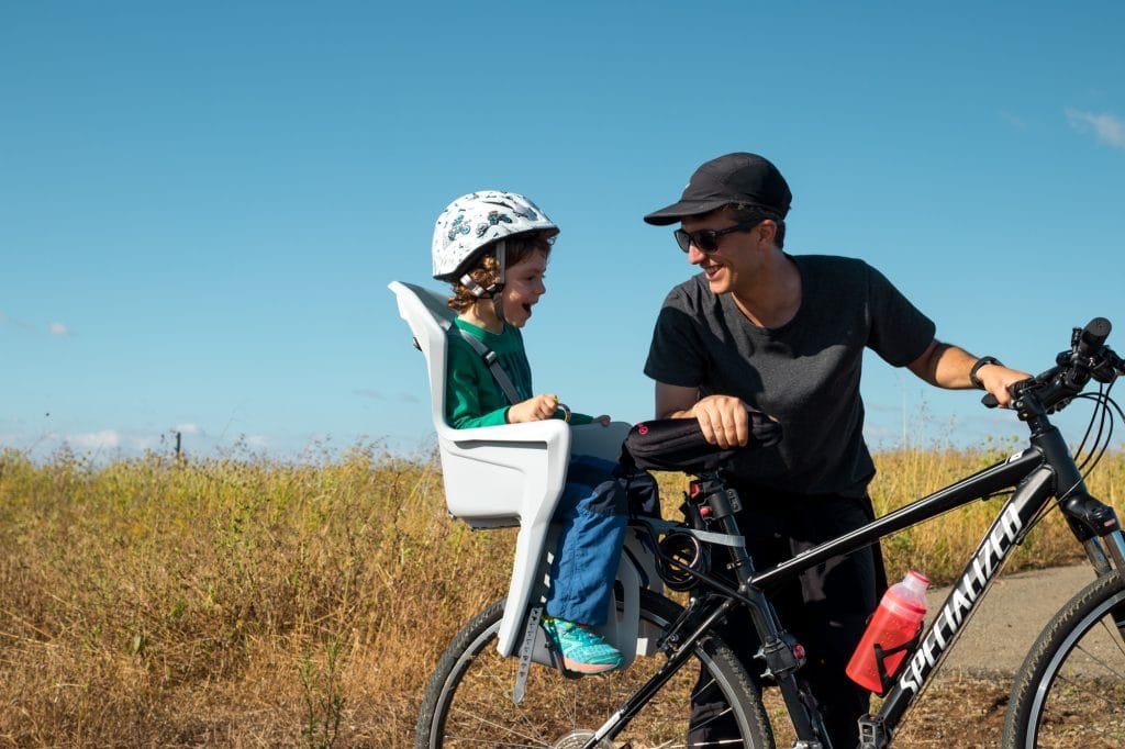 Back mounted child bicycle seat, our son hates it 4 bike child seat