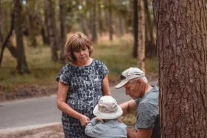 grandparents and grandchild in the nature