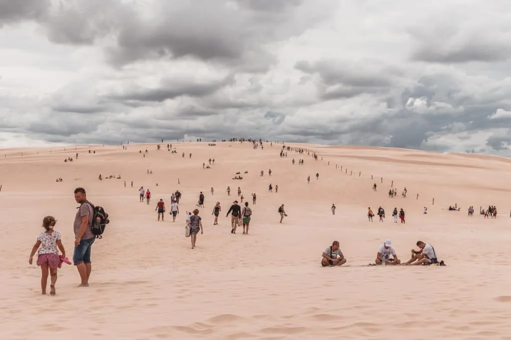 tourists in the dunes