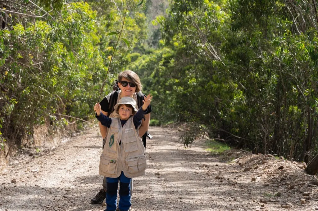 mon and son in a trail